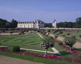 FRANCE, Indre et Loire, Loire Valley, Looking across formal gardens towards Chateau du Chenonceau.