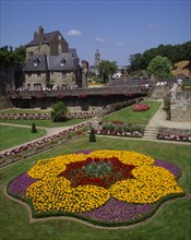 FRANCE, Brittany Morbihan, Vannes, Hermine Castle walls and formal gardens with colourful flowerbed