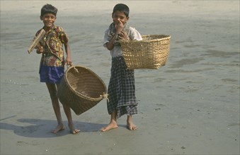 BANGLADESH, Children, Two young boys carrying large woven baskets.