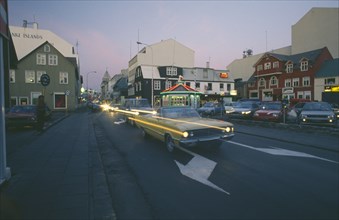 ICELAND, Reykjavik, City centre traffic on Summer evening.