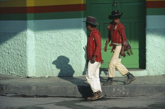 GUATEMALA, Huehuetanango, Mayan Indian men from the Sierra Los Cuchumatanes in street in Western