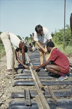 ZAMBIA, Transport, Construction workers under supervision on Canadian run railway.