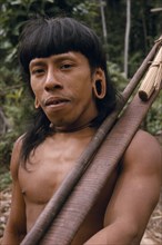 ECUADOR, Amazon, People, Waorani Indian hunter with blow gun.