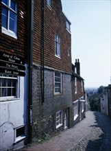 20059231 ENGLAND East Sussex Lewes View down cobbled old street with cottage housing and a street sign showing directions towards the Ann of Cleves House and Priory