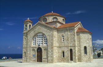CYPRUS, Cape Drepanon, Agios Georgiou church exterior with tiled roof and bell tower.