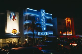 USA, Florida, Miami Beach, Ocean Drive hotel facades illuminated at night