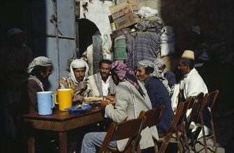 YEMEN, Sana, Group of men eating breakfast together.