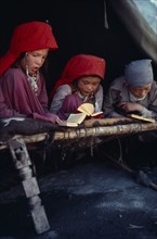 AFGHANISTAN, Kirghiz, Kirghiz boys and girls reading the Koran.