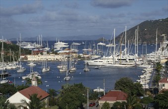 WEST INDIES, St Barthelemy, Gustavia, View over the port with yachts moored on water.