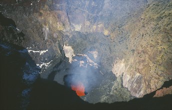 CHILE, Los Lagos, Volcan Villarrica, View down to red hot lava in crater of volcano in the lake