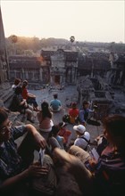 CAMBODIA, Siem Reap Province, Angkor Wat, Tourists with cameras watching the sunset from the