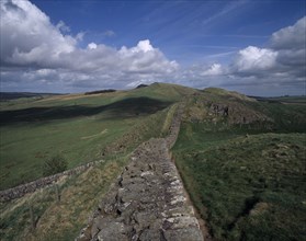ENGLAND, Northumberland, Hadrians Wall, View along stretch of ruined wall at Cawfields