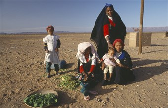 MOROCCO, Family, Tribal woman and children in desert area.