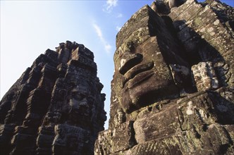 CAMBODIA, Siem Reap Province, Angkor Thom, The Bayon.  Detail of huge face thought to be that of