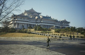 NORTH KOREA, Pyongyang, Grand peoples Study House exterior with people.
