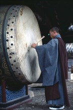 SOUTH KOREA, Religion, Buddhism, Buddhist temple drum being sounded.