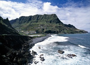 SPAIN, Canary Islands, La Gomera, Hermigua.  Coastal landscape with narrow beach of black volcanic