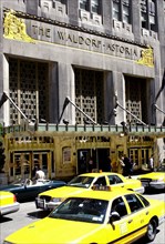 USA, New York State, New York City, Waldorf Astoria Hotel and yellow taxis
