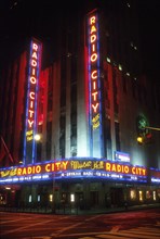 USA, New York State, New York City, Radio City Music Hall and the Rockefeller Centre illuminated at