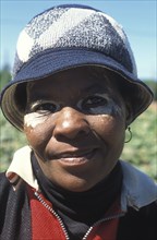 SOUTH AFRICA, Western Cape, Stellenbosch, Portrait of a female agricultural farm worker at Mooiberg
