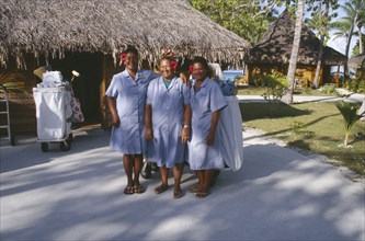 PACIFIC ISLANDS, French Polynesia, Tuamotu Islands, Ringiroa.  Women workers in hotel complex.