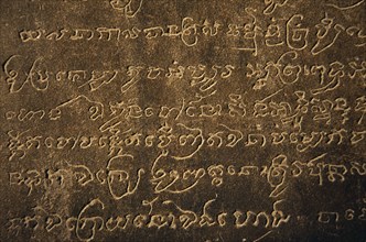 CAMBODIA, Siem Reap Province, Angkor Wat, Detail of carved sanskrit text on third level of temple.