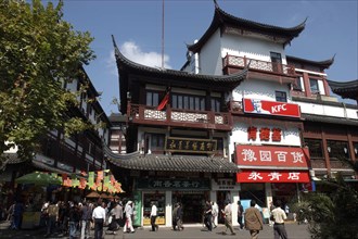 CHINA, Shanghai, Yuyuan Gardens. Three tiered traditional style building with shops and KFC fast