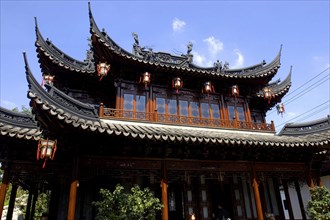CHINA, Shanghai, Yuyuan Gardens. angled view looking up at the elaborate roof of a traditional