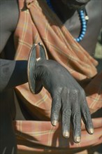 UGANDA, Karamoja, Tribal Poeple, Cropped shot of Karamojong Dodoth warrior displaying wrist knife