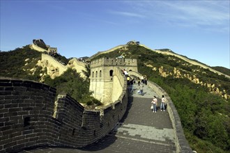 CHINA, Great Wall, View along a section of the wall which leads through the green hilly landscape