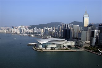 HONG KONG, Kowloon, Aerial view over the New Convention Centre on the waterfront and cityscape