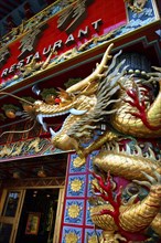 HONG KONG, General, Elaborately decorated Restaurant exterior with golden dragon sculpture