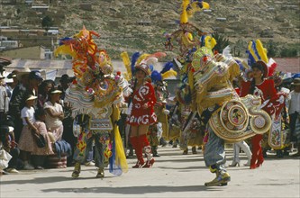 BOLIVIA, Oruro, La Diablada Carnival procession and spectators.