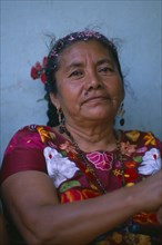 MEXICO, Oaxaca, Juchitan, Head and shoulders portrait of woman.  Family matriarch.