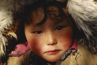 CHINA, Xinjiang, Altai, Portrait of Kazakh child.