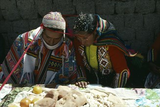 PERU, Cordillera Vilcanota, Bride and groom during their wedding ceremony with length of red