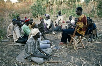 SUDAN, Tribal People, Storytelling in Dinka village.