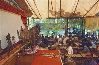 INDONESIA, Java, Yogyakarta, Shadow puppet show with Wayang and Gamelan orchestra behind the scenes