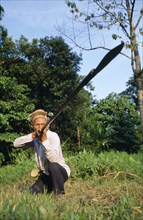 MALAYSIA, Sarawak, Dayak hunter with blowpipe
