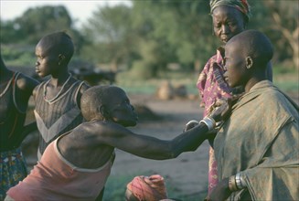 SUDAN, Rituals, Dinka blessing with oil.