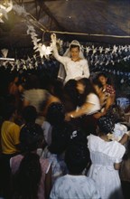 MEXICO, Oaxaca, Juchitan, Bride and guests at traditional Zapotec wedding.
