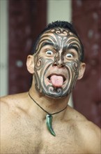 HAWAII, People, Polynesian Cultural Centre.  Man demonstrating traditional New Zealand Maori
