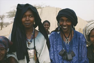 NIGER, Tribal People, Head and shoulders portrait of two Tuareg women near Tanout wearing typical