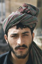 PAKISTAN, People, Portrait of a man wearing a head scarf.