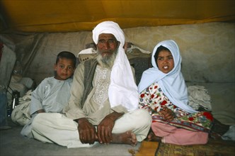 AFGHANISTAN, Nomadic LIfestyle, Portrait of nomad family in their tent.