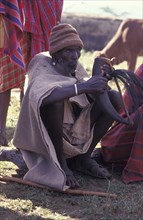 KENYA, Kajiado, Gourds filled with honey beer are drunk at the beginning of the an initiation