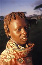 KENYA, Kajiado, Portrait of Torrengai a young Maasai Moran during his initiation into manhood.
