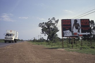 KENYA, , AIDs poster at the side of the main truck route that connects Kenya with Uganda. Aids was