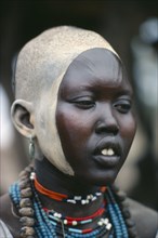 SUDAN, Body Decoration, Portrait of young Dinka woman with facial decoration of ash paint and