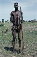 SUDAN, People, Portrait of Dinka warrior carrying spears with his body painted with a mixture of